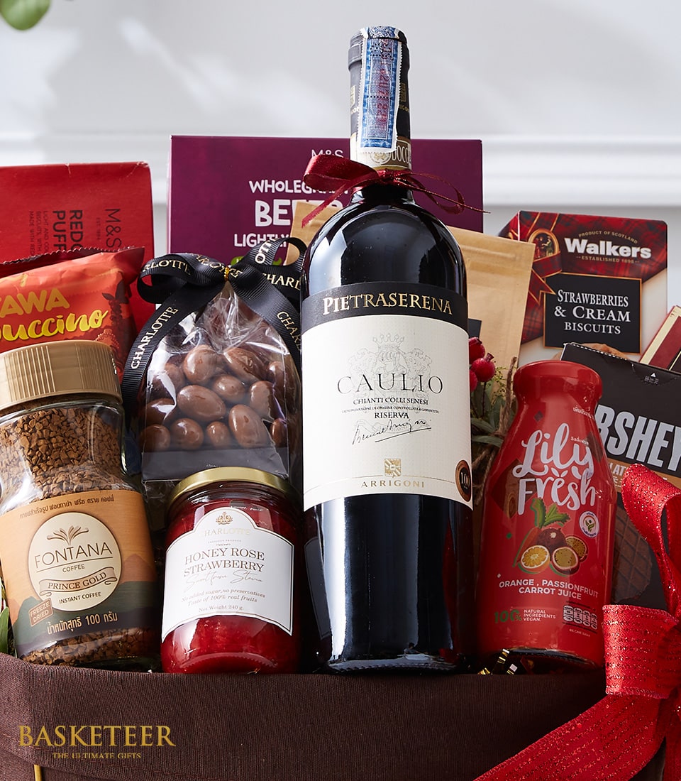 Premium wine and gourmet gift basket with red wine, artisan coffee, chocolate, jam, and gourmet snacks