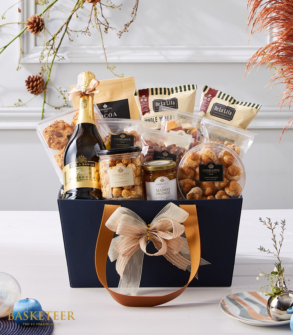 Navy luxury gift basket with Prosecco, artisan cookies, nuts, dried fruit, and gourmet treats