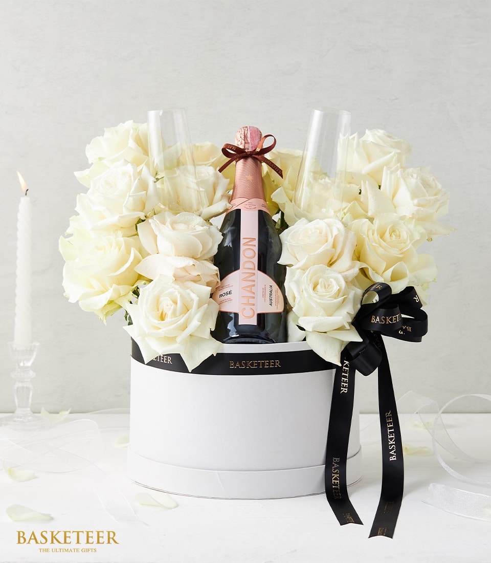 Luxury white rose and Chandon sparkling wine gift set in hatbox with champagne flutes, anniversary celebration arrangement