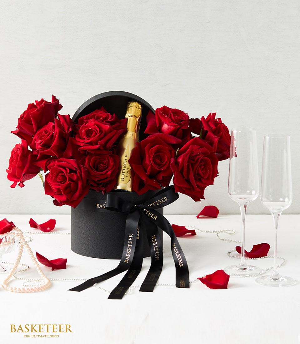 Red roses and Prosecco luxury gift set with champagne flutes for Valentine's Day and anniversaries