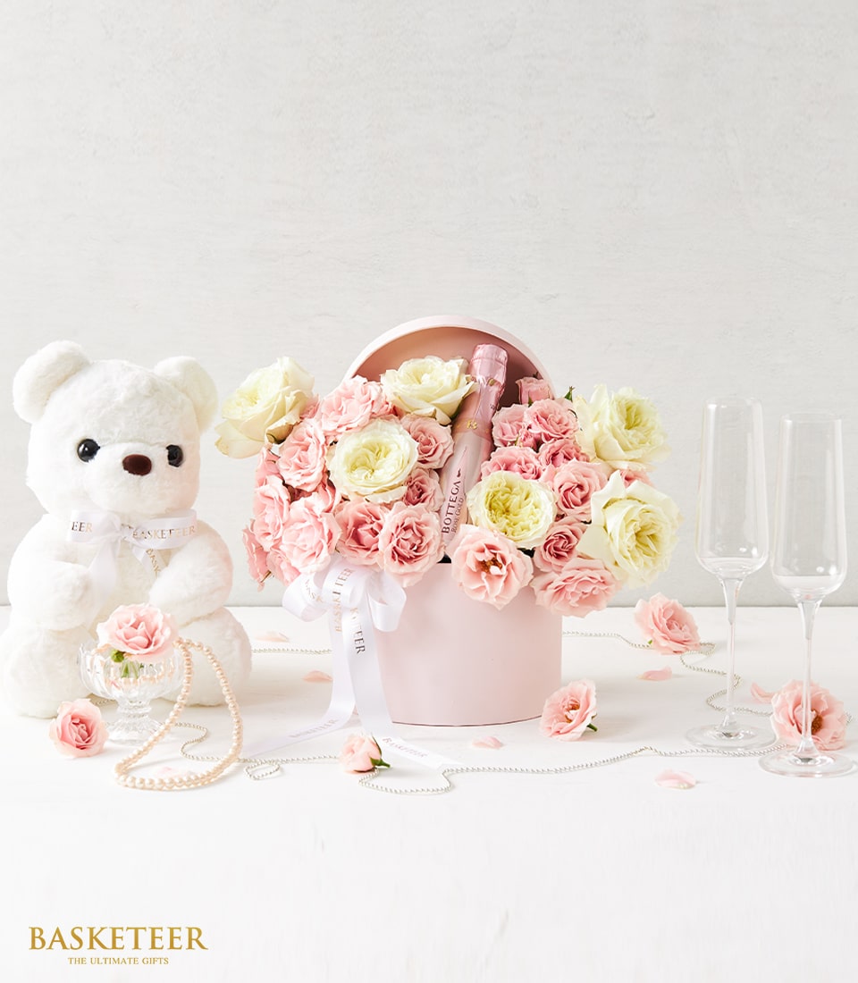Blush roses, sparkling wine, and teddy bear anniversary gift set in pink hatbox