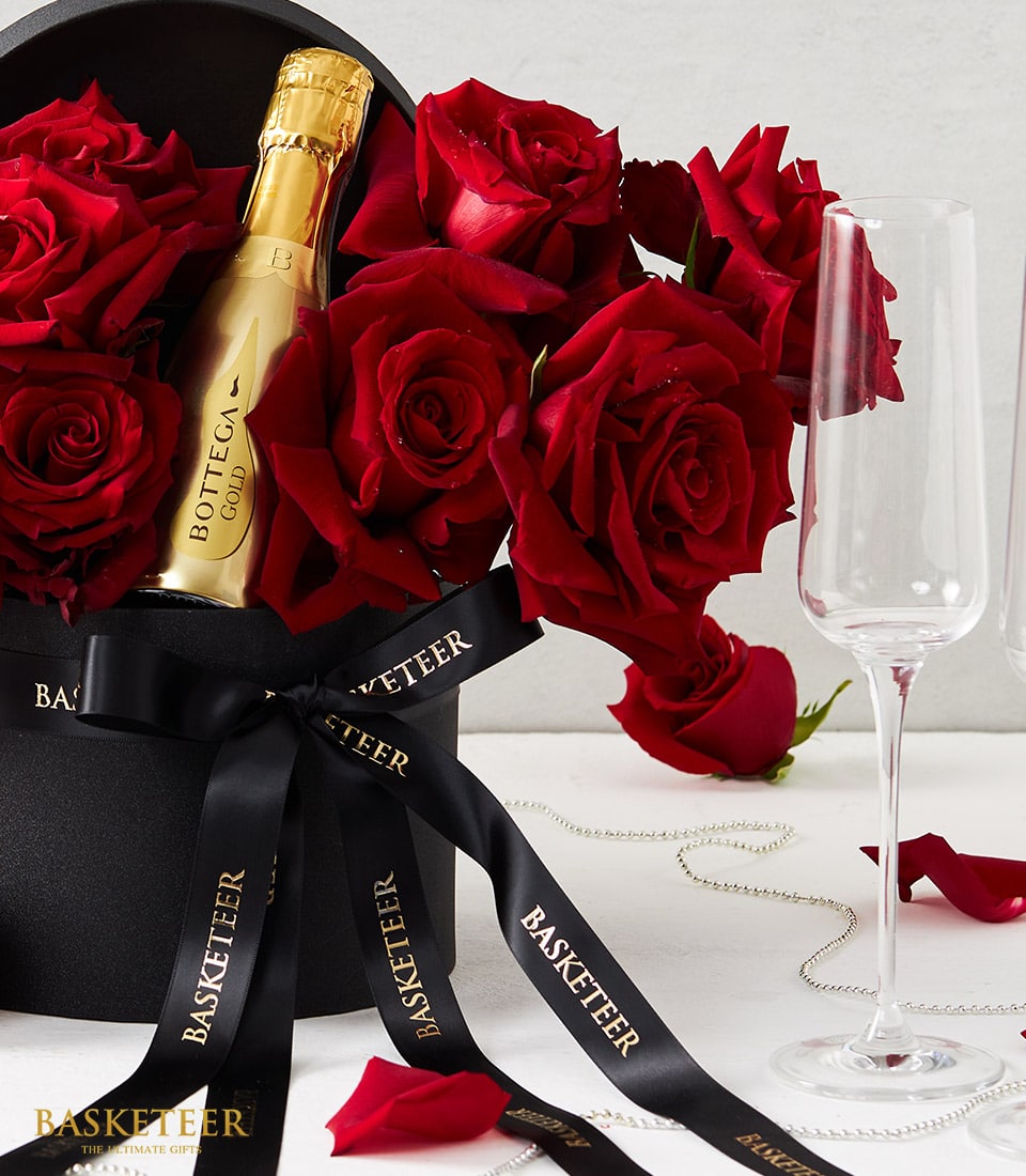 Red roses with mini sparkling wine in luxury black hatbox, anniversary gift set with champagne flutes