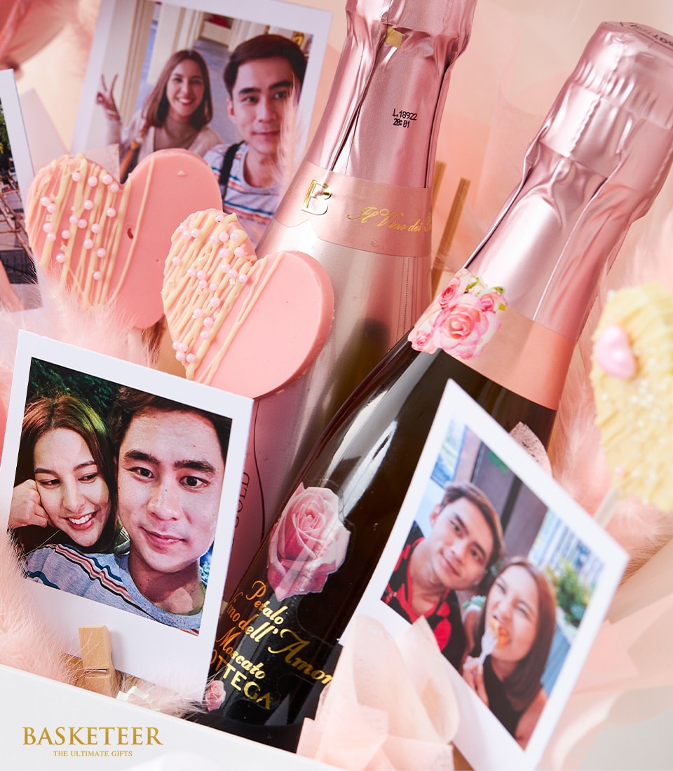 Rosé wine gift box with couple photos, heart-shaped chocolates, and "I Love You 3000" balloons for anniversaries