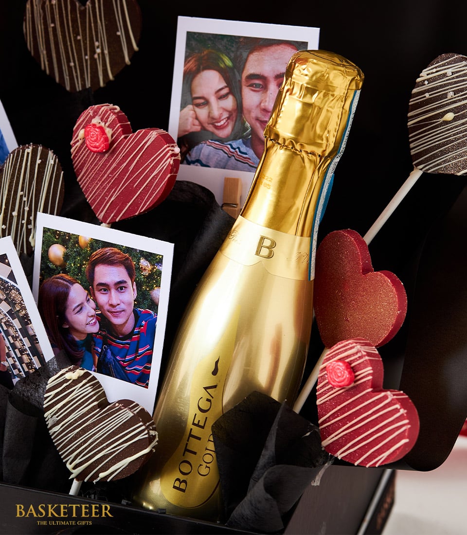 Luxury personalized Valentine wine box with Bottega Gold champagne, heart-shaped treats, and couple photo prints