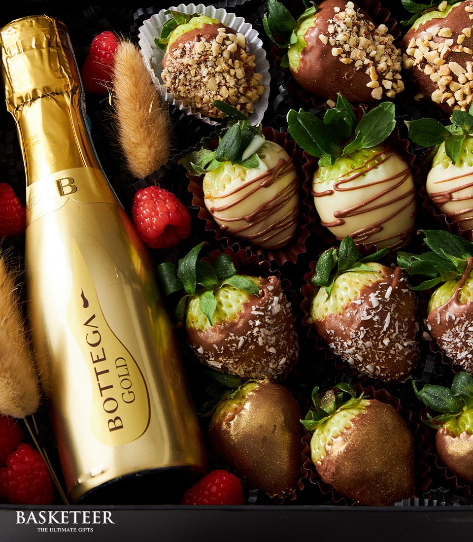 Luxury sparkling wine and chocolate-covered strawberries Valentine gift set with gold edible dust finish