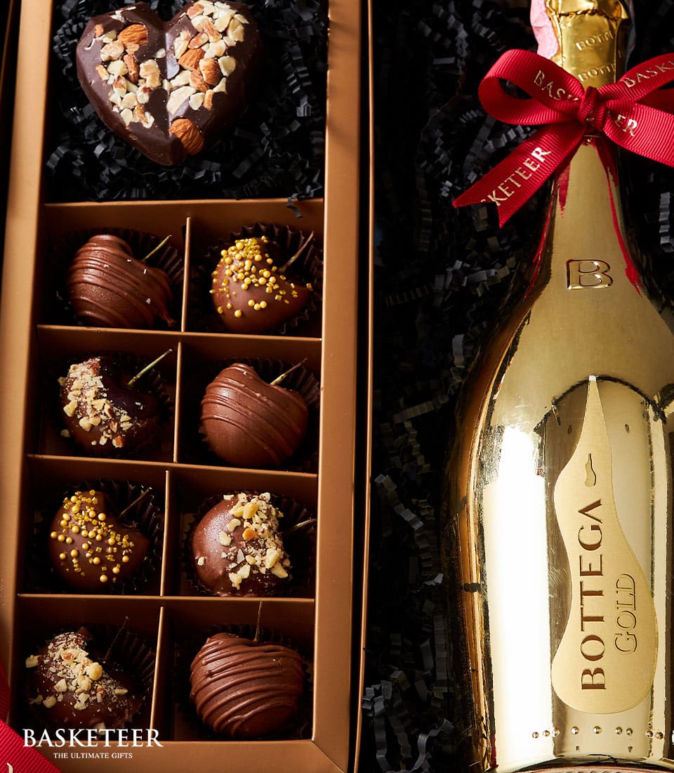 Luxury sparkling wine and gold chocolate gift box for Valentine's Day, featuring Bottega Gold bottle with heart-shaped and