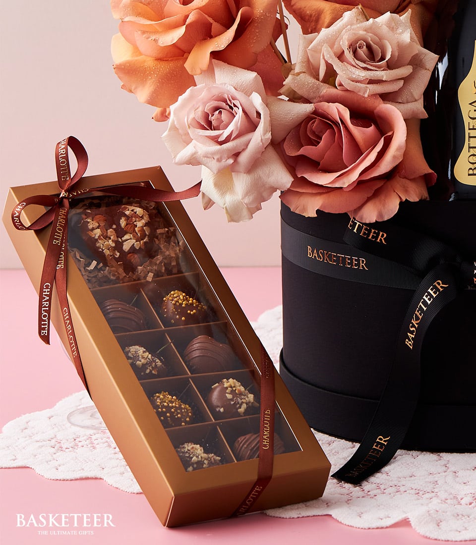 Luxe champagne, premium roses, and artisan chocolates gift set for anniversary celebration