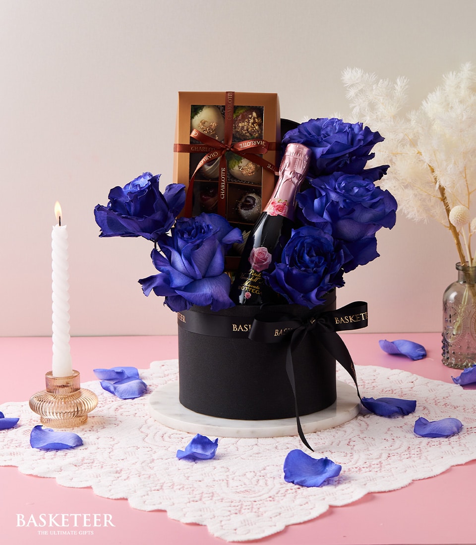 Luxury blue rose bouquet with pink sparkling wine and gourmet chocolates in black gift box