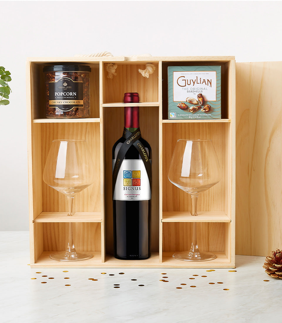 Classy Romance wine gift crate with red wine, chocolates, popcorn, and glasses in wooden box