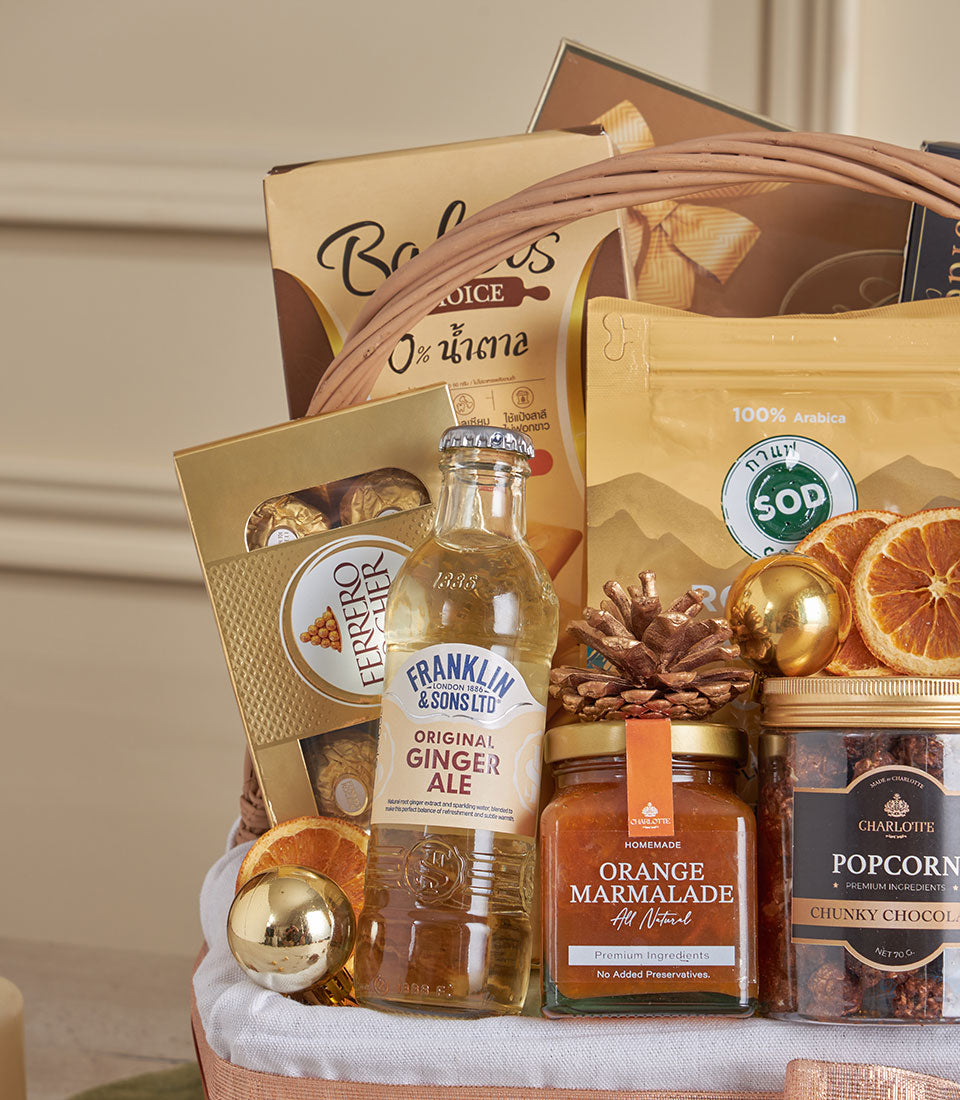 Golden gourmet gift basket with Ferrero Rocher, artisan marmalade, specialty coffee, and chocolate treats for New Year