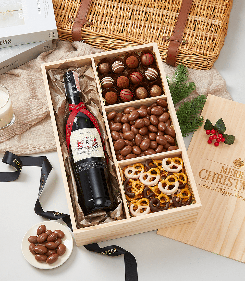 Premium wine and chocolate gift box with Cabernet Sauvignon, truffles, almonds, and pretzels in natural wood packaging