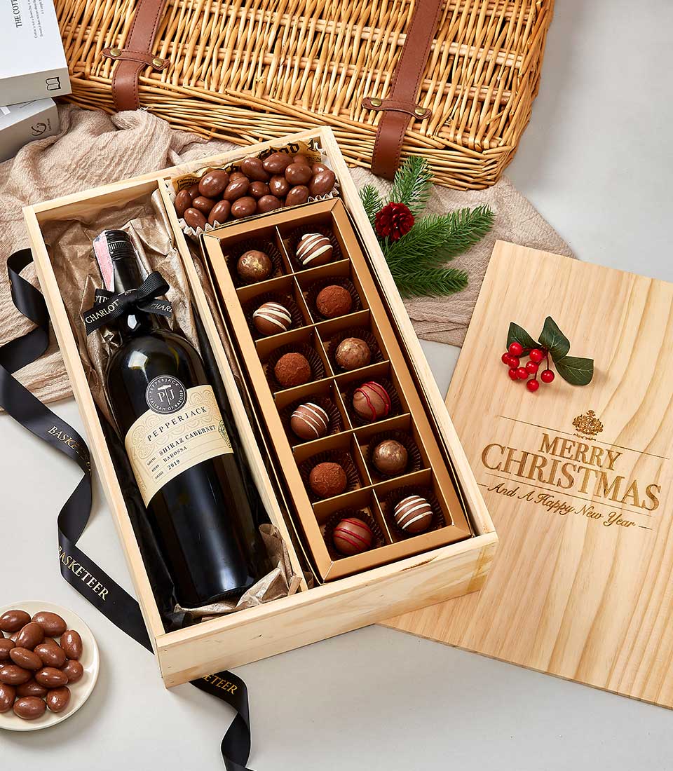 Premium wine and chocolate gift box with Shiraz, gourmet truffles, and chocolate-covered nuts in pine wood case