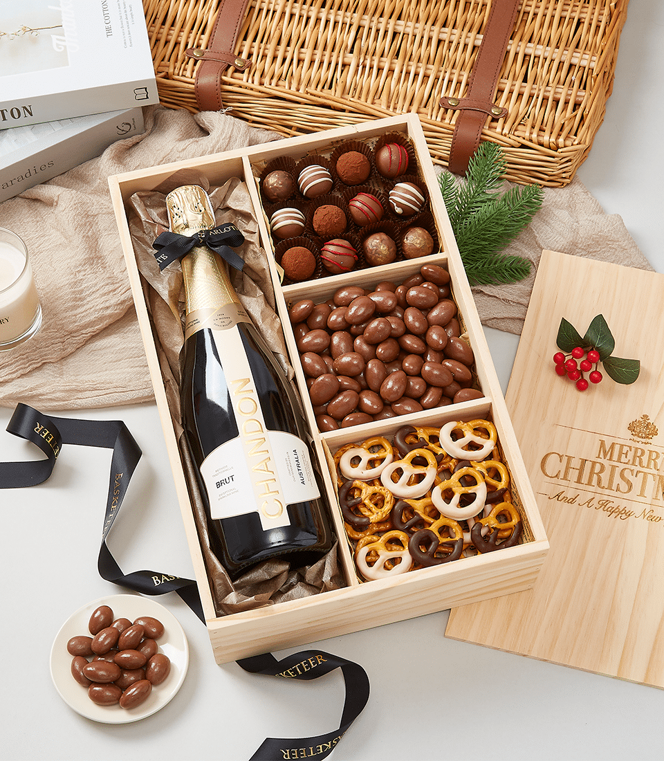 Chandon sparkling wine wooden gift box with chocolate truffles, nuts, and pretzels