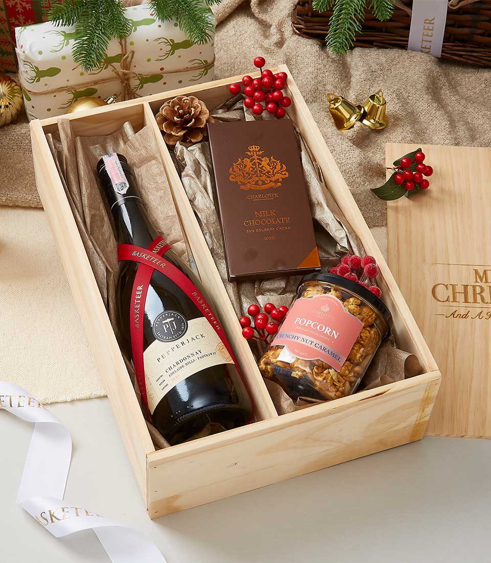 Premium wine and chocolate gift box with caramel popcorn in natural wood compartments