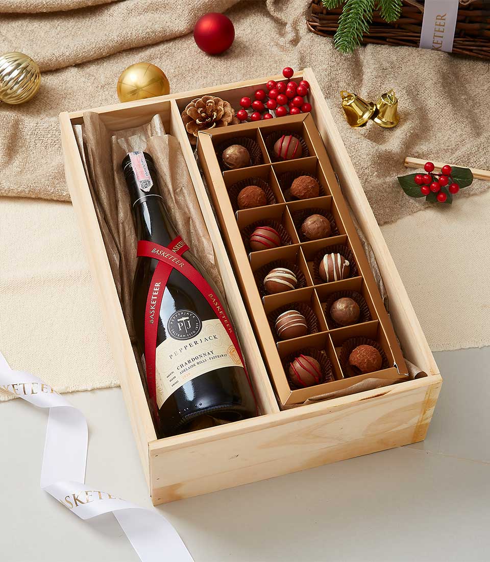 Premium wine and chocolate gift box with Pepperjack Chardonnay, artisan truffles in wooden case, festive red ribbon