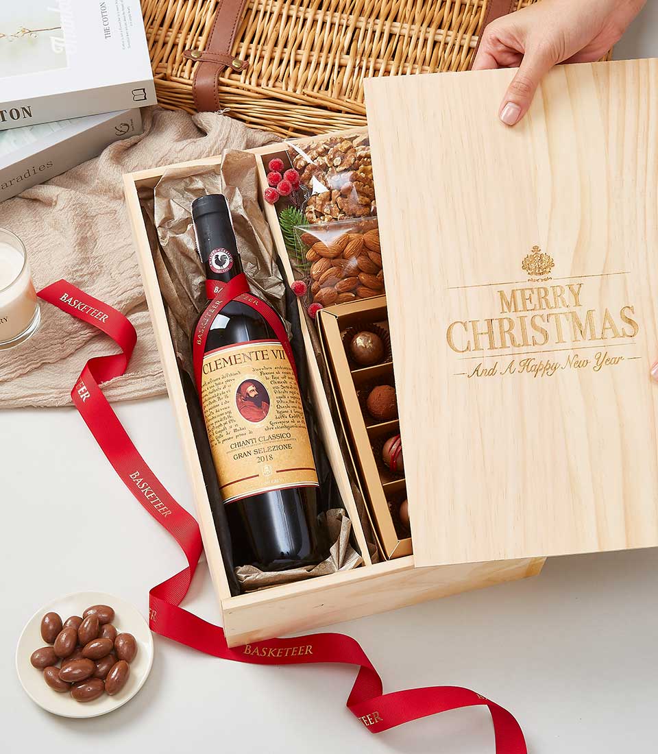 Chianti Classico wine with premium chocolates and nuts in festive wooden gift box