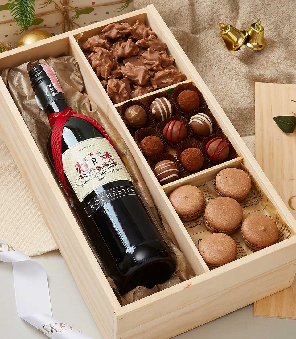 Premium wine and chocolate gift box with Cabernet Sauvignon, chocolate clusters, truffles, and macarons in wooden