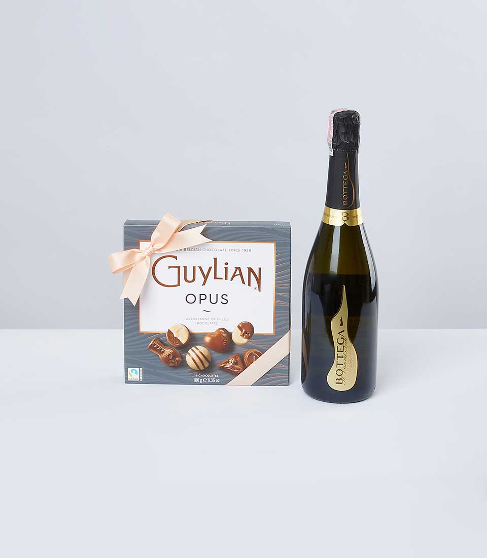 Guylian chocolate box with pink ribbon and Bottega sparkling wine gift set for celebrations