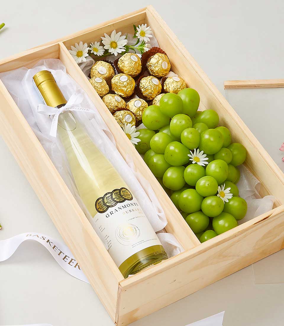 Premium white wine and Ferrero Rocher gourmet gift box with fresh grapes and gold chocolates