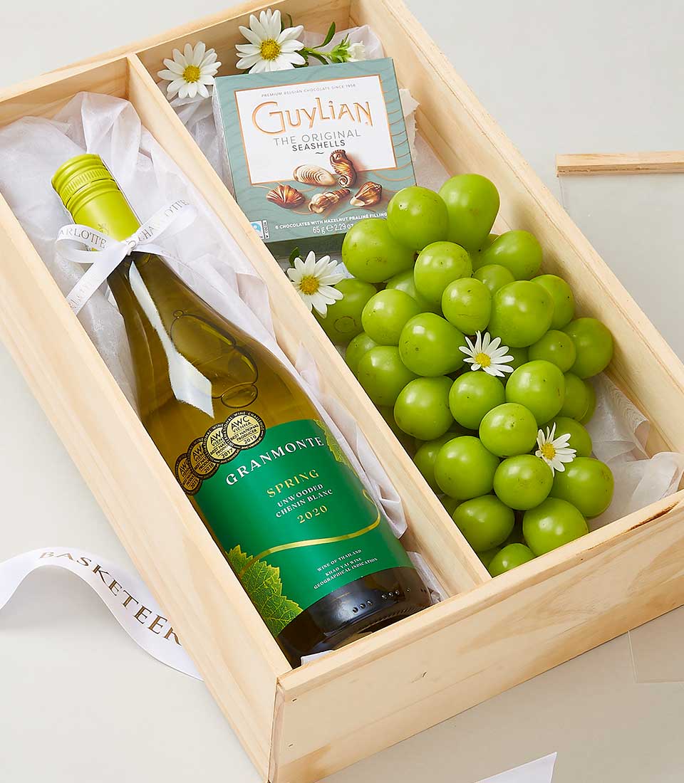 Premium white wine gift box with Grammonte Chenin Blanc, Guylian chocolates, fresh green grapes, and white daisy flowers