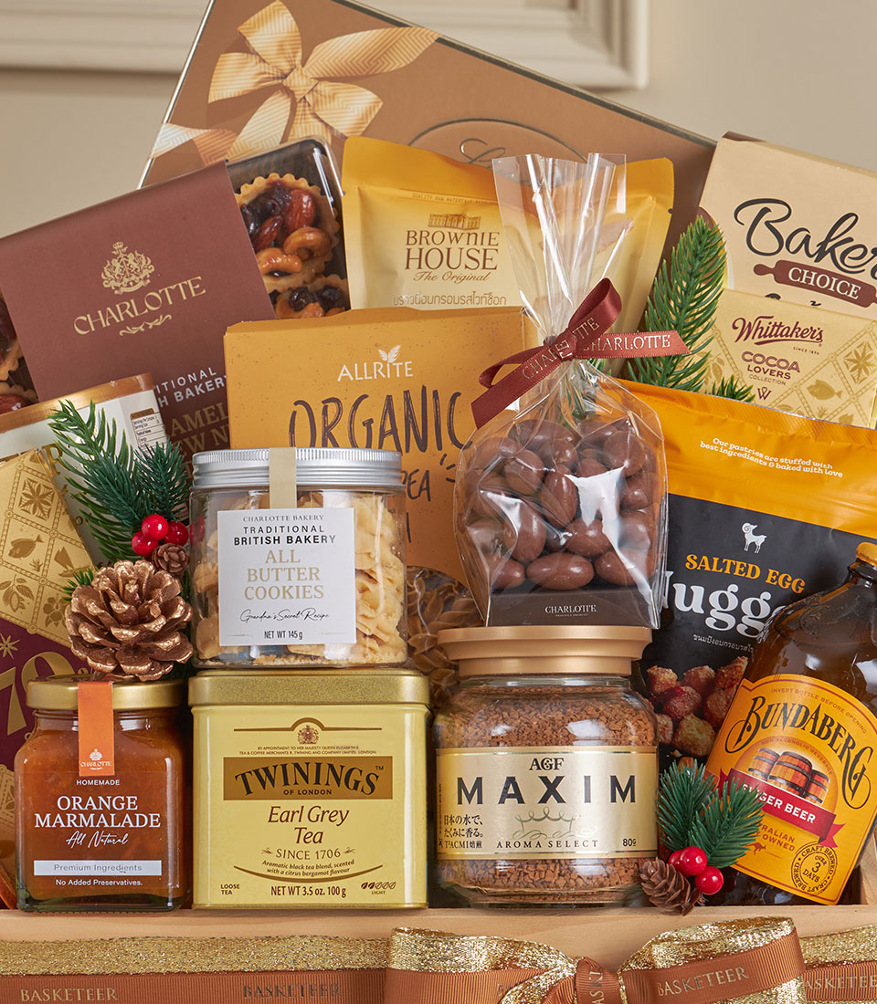 Classic wooden gourmet hamper with marmalade, Earl Grey tea, cookies, chocolate almonds, and ginger beer for New Year gifting