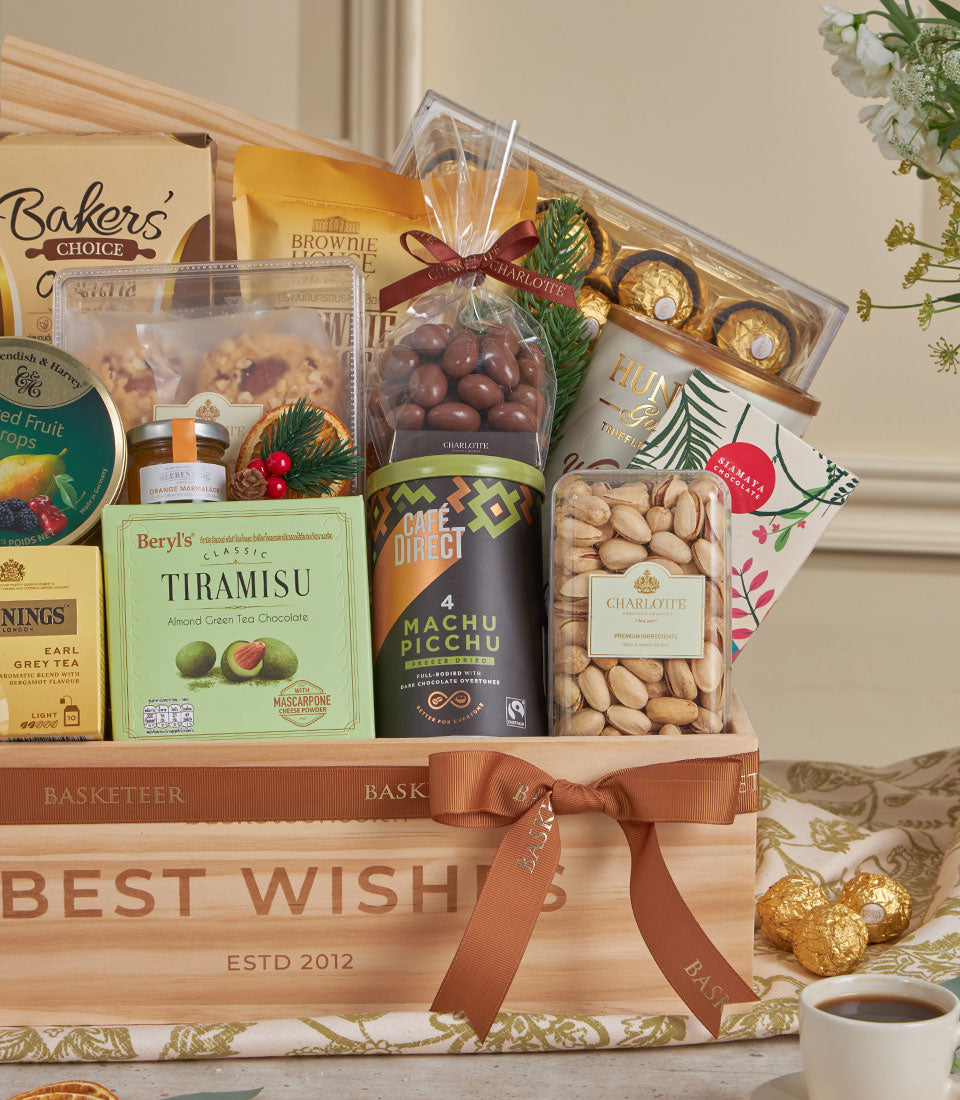 Golden Deluxe gourmet gift box with premium chocolates, coffee, tea, and artisan treats for New Year wishes