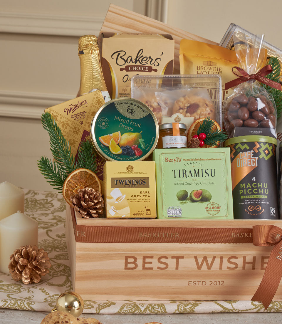 Wooden luxury gift hamper with champagne, gourmet chocolates, and artisan treats for New Year celebrations