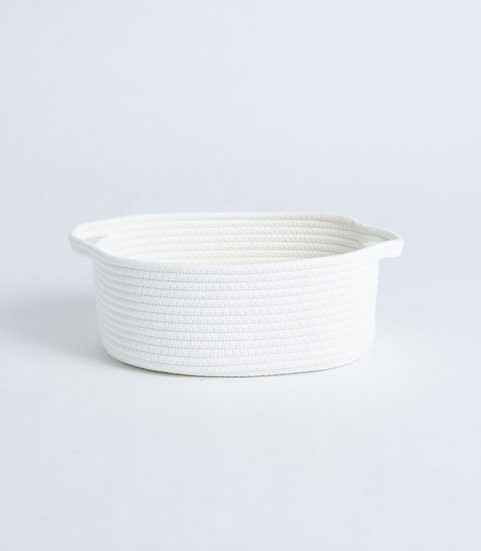 White rope oval storage basket with woven handles, minimalist design for home organization