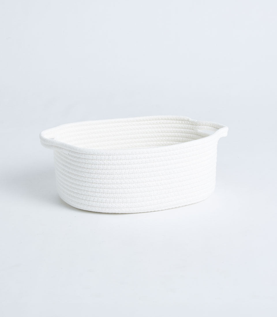 White cotton rope oval storage basket with dual handles, minimalist woven design