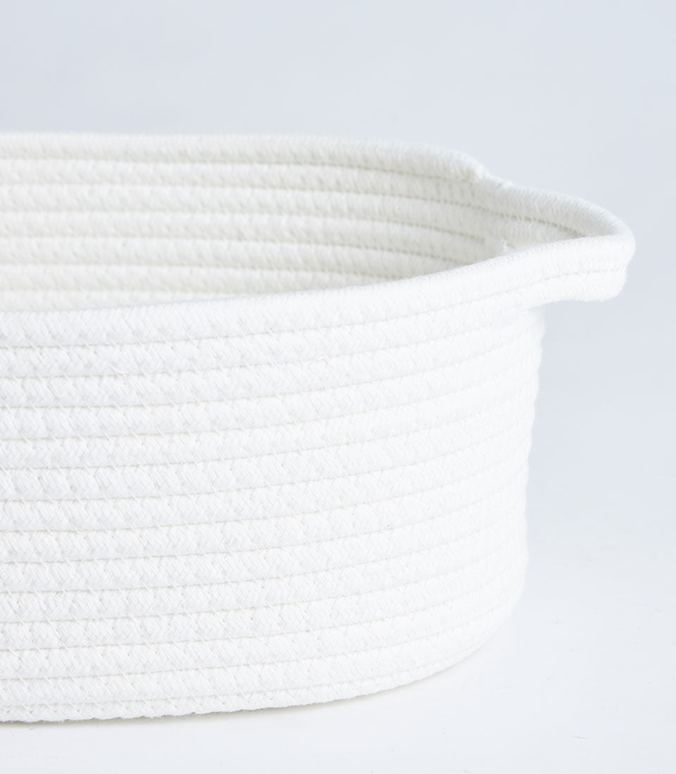 White woven cotton rope storage basket with dual handles, minimalist artisan design
