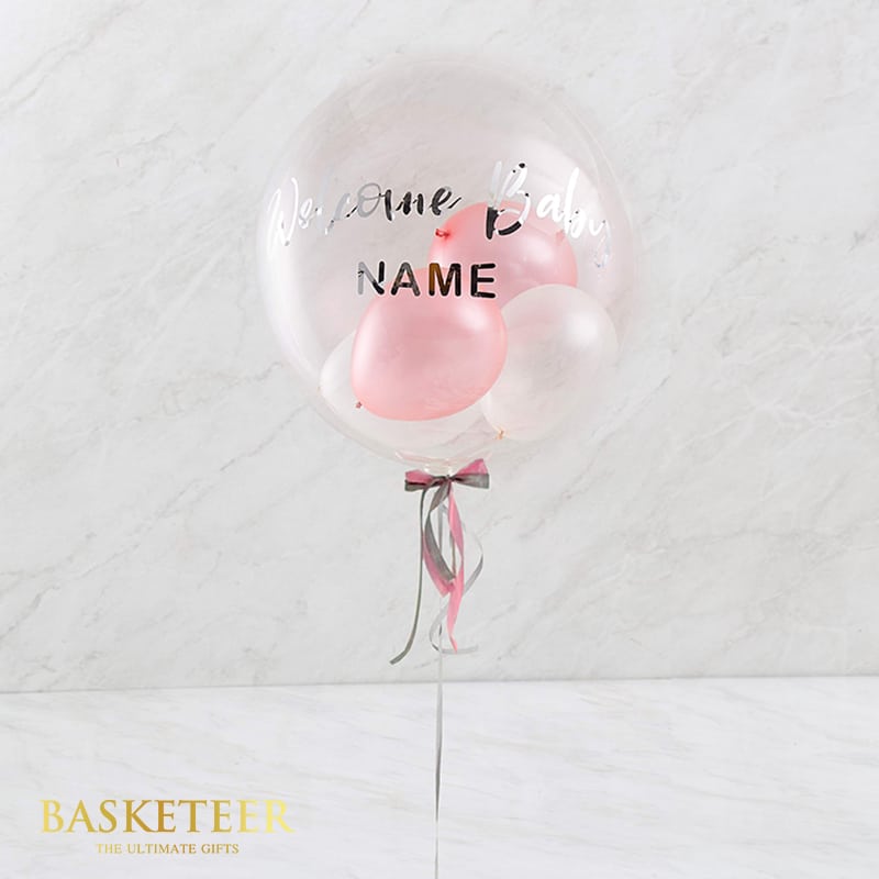 Pink bubble balloon with personalised welcome baby message and ribbon, newborn gift