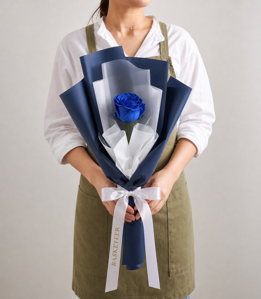 Elegant single blue rose bouquet from Flowers by Basketeer, wrapped in luxurious