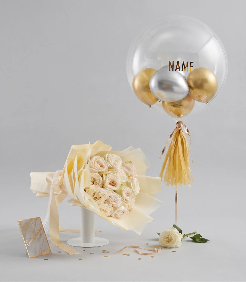 Basketeer luxury gift of creamy white roses in elegant wrap with a personalized gold