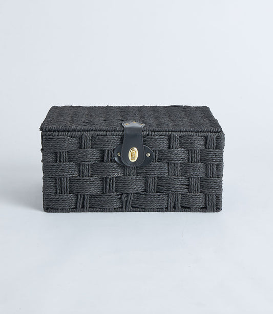 Rectangular black woven storage basket with leather lock and gold clasp