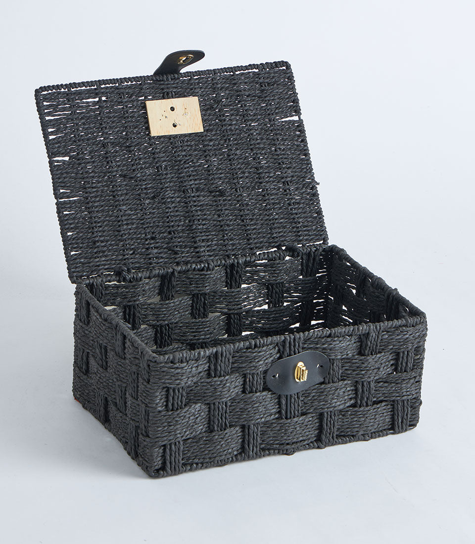 Black woven storage basket with leather lock and hinged lid