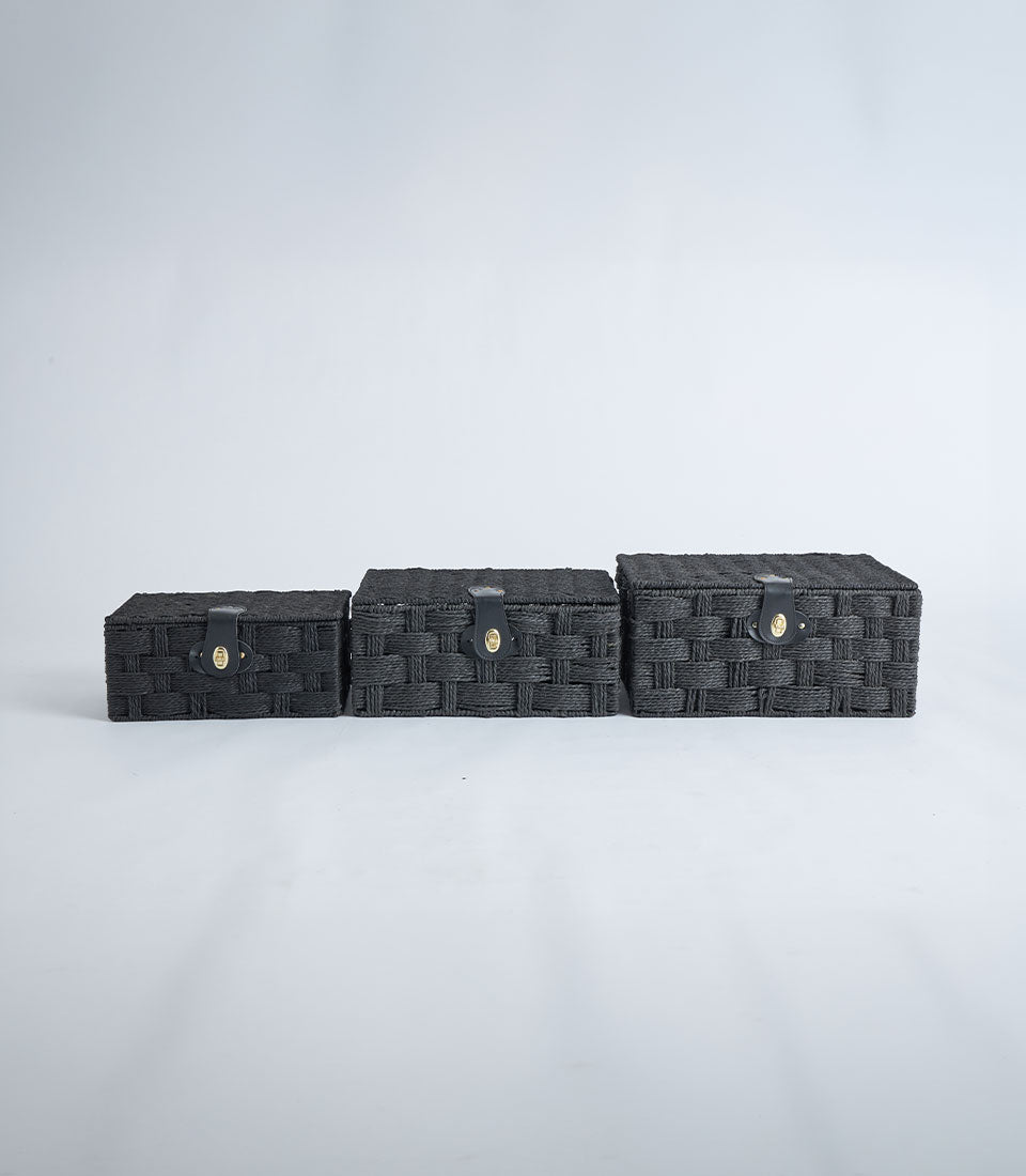 Black woven storage baskets with leather lock closure, set of three nested sizes