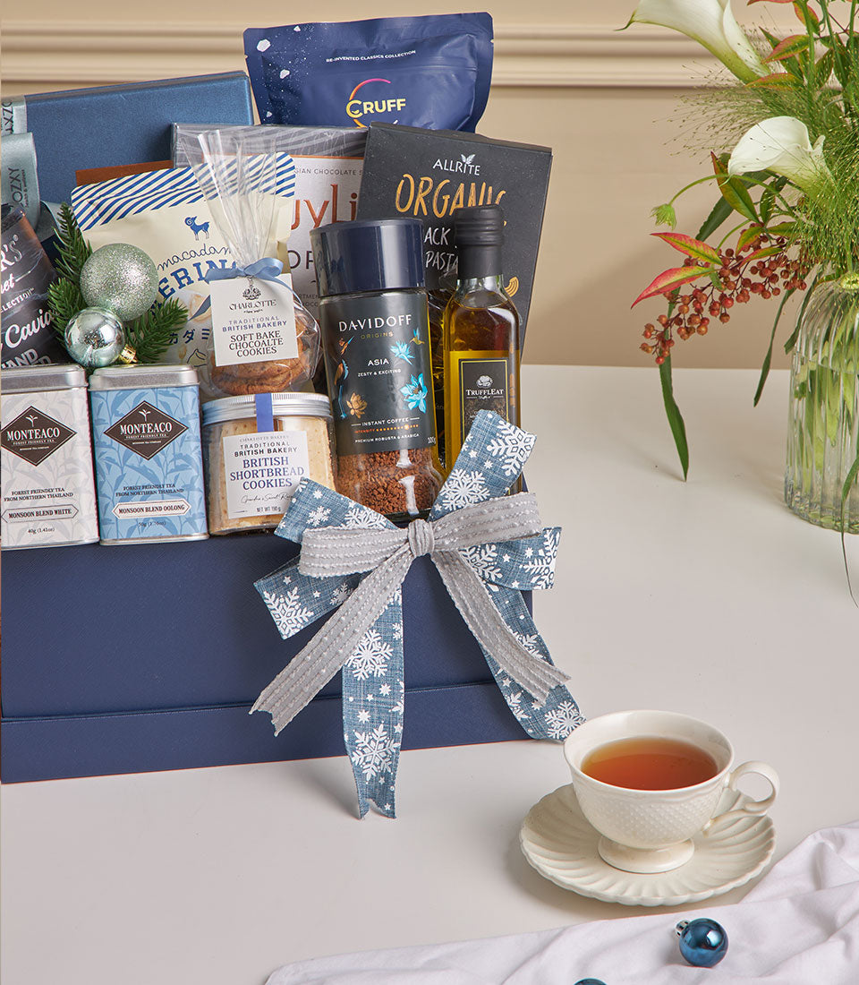 Luxury New Year gift hamper with black truffle, bird's nest, gourmet chocolates and premium tea in dark blue festive box