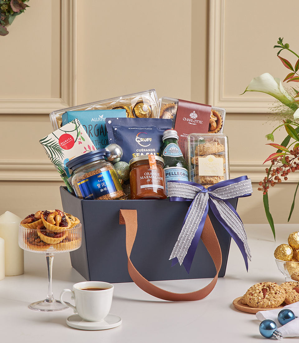 Luxury chocolate and coffee gift basket with purple ribbon, gourmet treats, and artisan coffee for New Year gifting