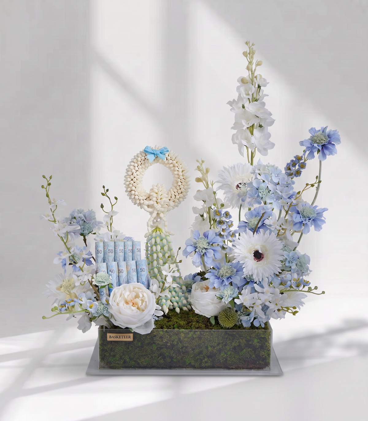 Basketeer's luxury gift box featuring a traditional jasmine garland, rolled Thai