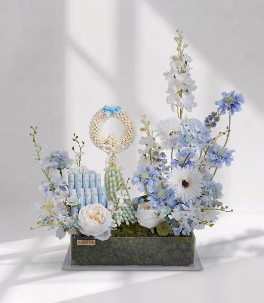 Basketeer's luxury gift box featuring a traditional jasmine garland, rolled Thai