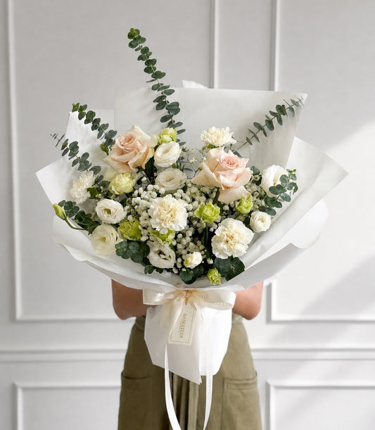 Luxurious Basketeer gift bouquet with ivory Quicksand roses, white