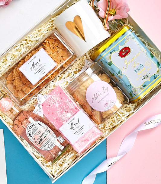 Premium Mother's Day gift set with jasmine tea, cookies, and artisan treats in white keepsake box