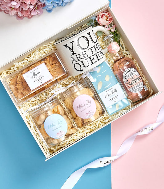 Mother's Day luxury gift box with almond cookies, Singapore cookies, mixed nuts, pink grapefruit tonic, and queen mug