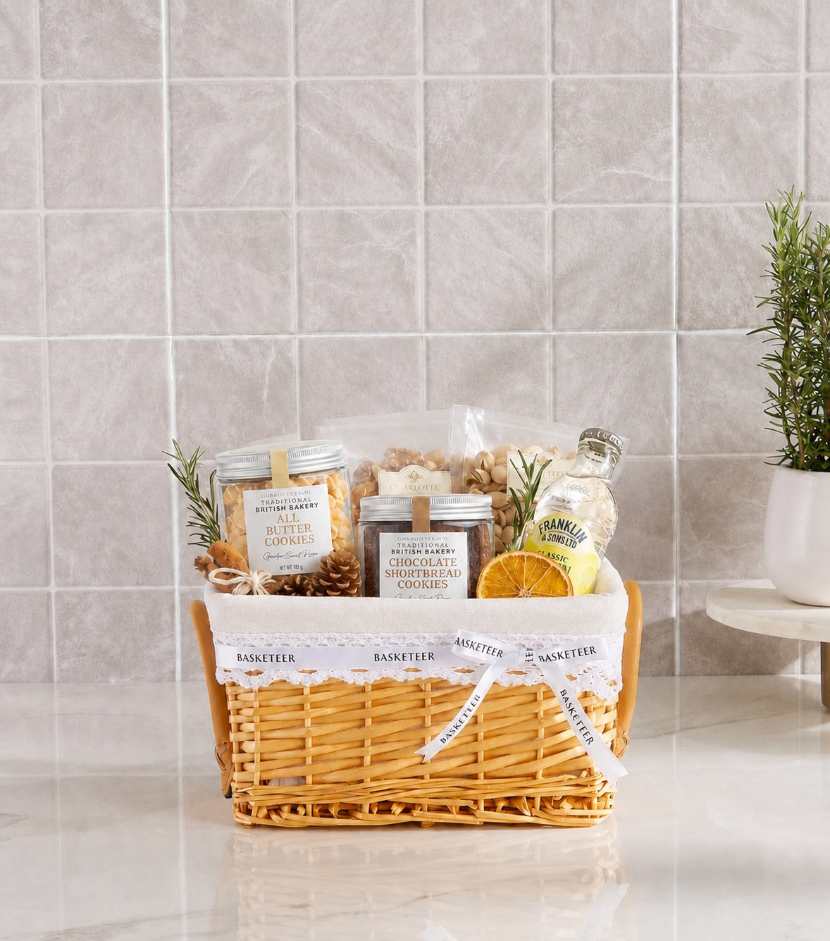Basketeer premium hamper with golden wicker basket, cream liner, and white logo