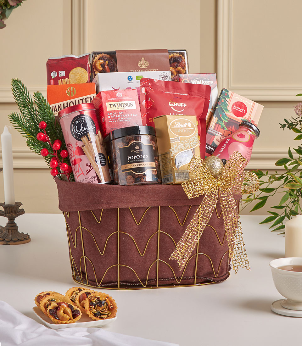 Premium New Year gift hamper with gourmet chocolates, tea, and artisan tartlets in gold wire basket