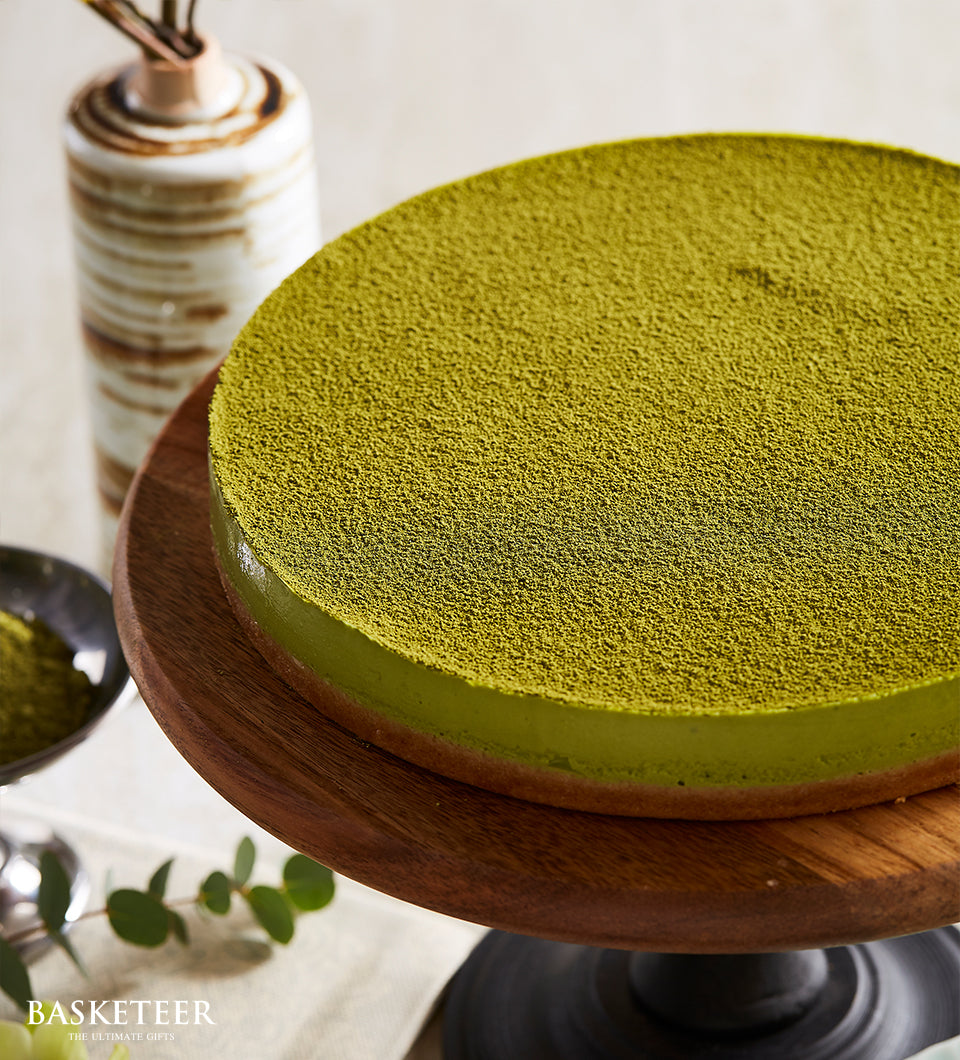 Creamy matcha cheesecake with vibrant green tea powder, elegant gift for celebrations and special occasions