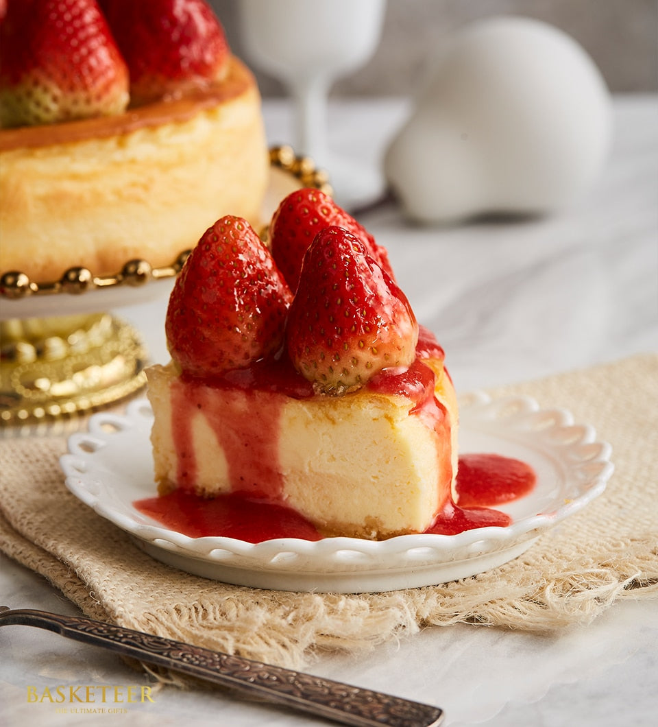 Classic New York strawberry cheesecake slice with fresh berries and creamy filling for celebration cakes
