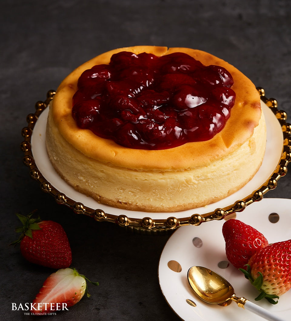 New York cheesecake with strawberry compote topping and fresh berries, artisan birthday cake gift