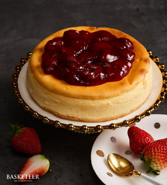 New York cheesecake with strawberry compote topping and fresh berries, artisan birthday cake gift