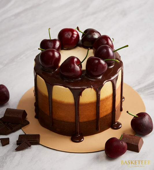 Mini three-layer chocolate cake with cherry ganache and gold board, artisan celebration dessert